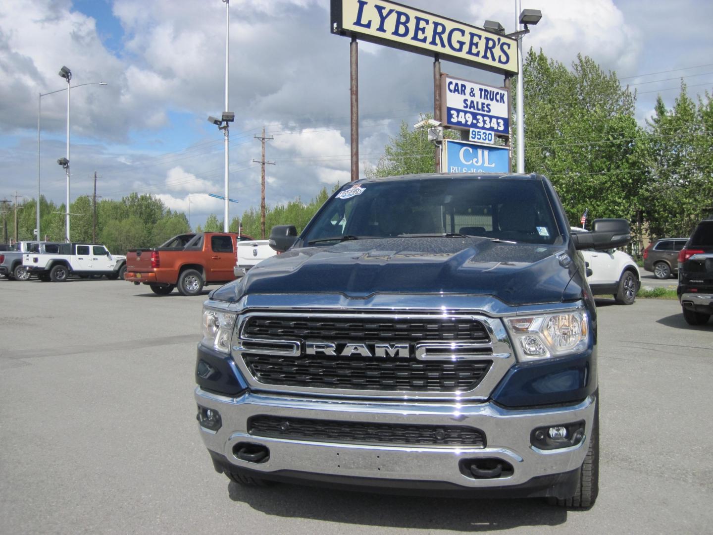 2023 blue /gray RAM 1500 Big Horn Crew Cab 4WD (1C6SRFMTXPN) with an 5.7L V8 OHV 16V engine, 8A transmission, located at 9530 Old Seward Highway, Anchorage, AK, 99515, (907) 349-3343, 61.134140, -149.865570 - Low Miles on this 2023 Ram 1500 Big Horn come take a test drive - Photo#1